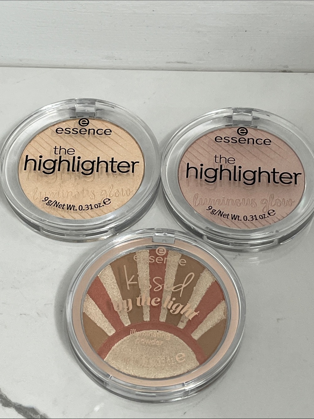 Essence kissed by the light illuminating powder star kissed and highlighter lot